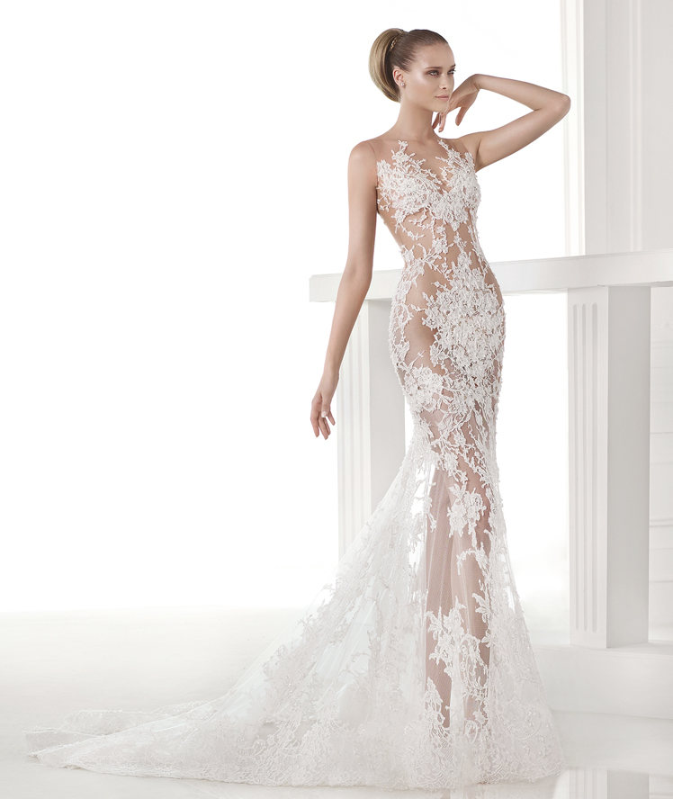 Carola from Pronovias Atelier is a Modern, tulle, mermaid dress with lace appliqué in all the right places.