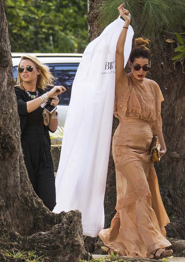 Under wraps the only hint of what Kimberley wore on her wedding day is this dress bag which appears to have the Berta Bridal logo written on it. Image XPOSURE via Daily Mail