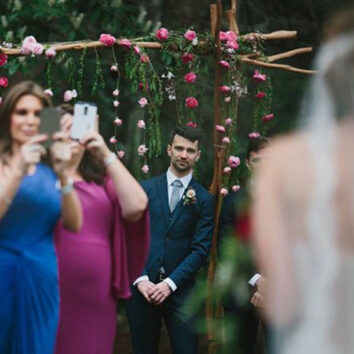 This photo, by Thomas Stewart Photography, sums up our bride's concerns about guests taking photos with their mobile phones during her ceremony.