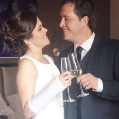 Elin and hubby share a toast on their wedding day in New York