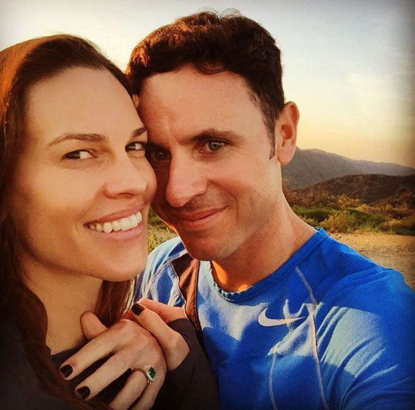 Hilary shared this sweet snap of her and fiance Ruben sharing a kiss to commemorate the occasion. Image Hilary Swank via Twitter