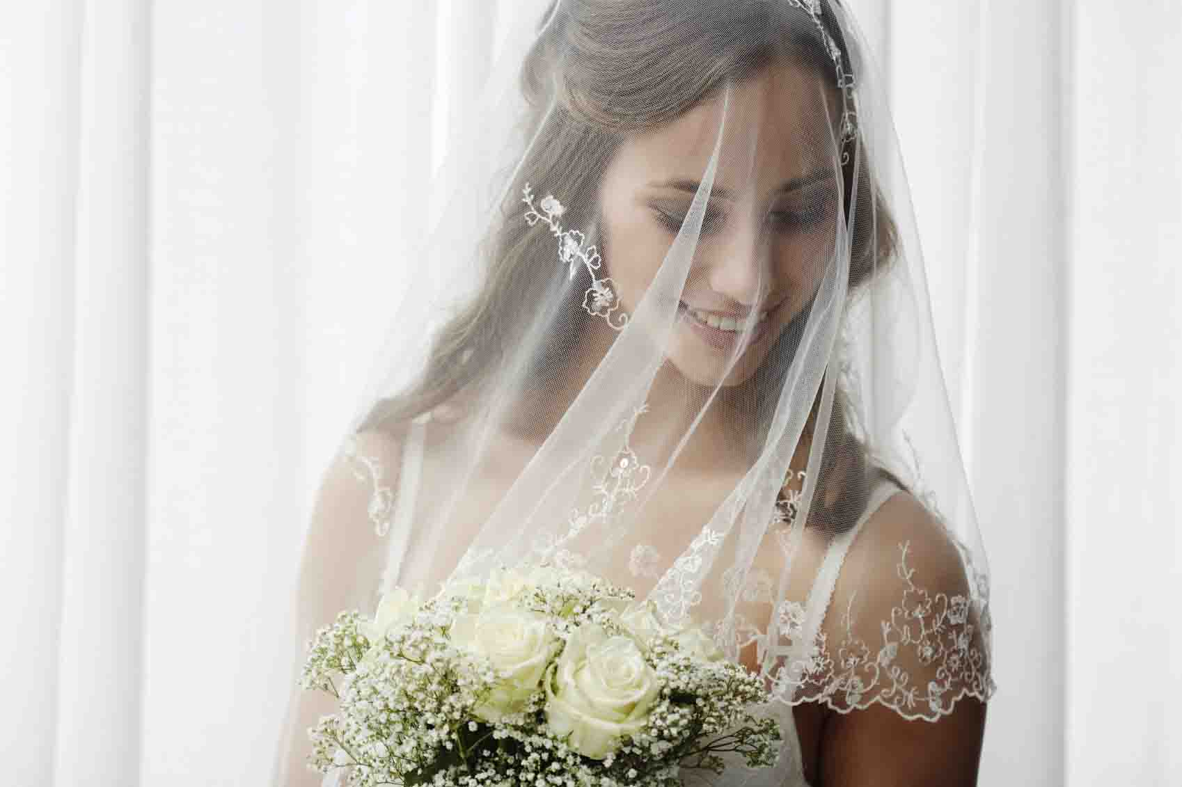 bride wearing a veil on her wedding day 