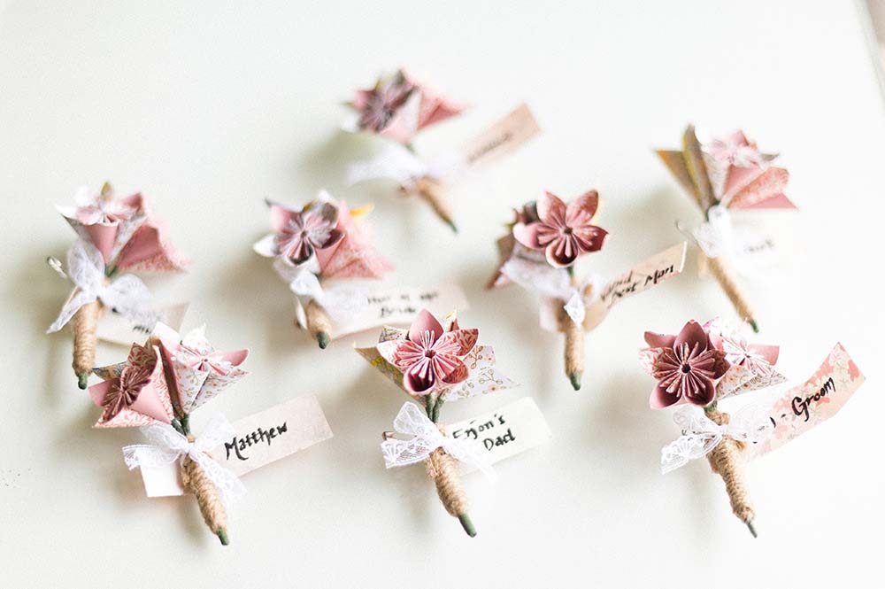 Origami buttonholes for wedding Image Anushe Low Photography