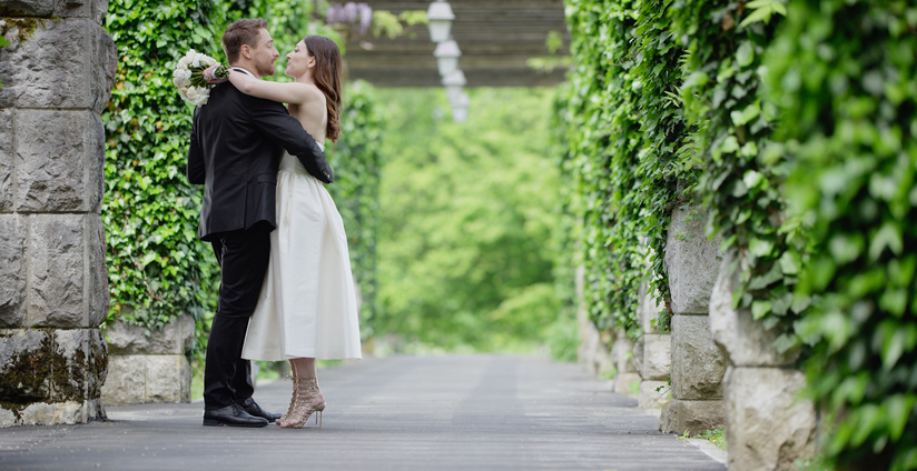 Bride and groom together in park