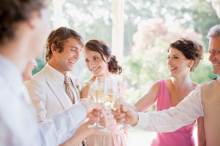 Guests toasting with champagne at wedding reception