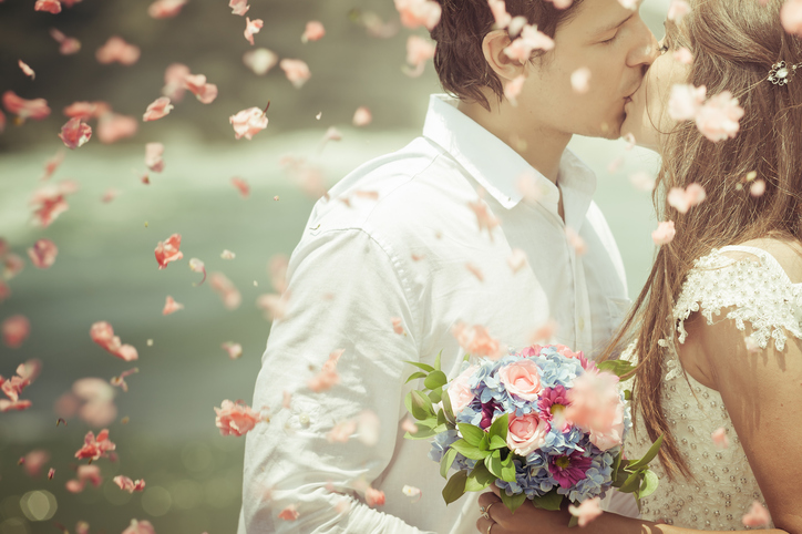 Old photo of wedding couple with bridal bouquet