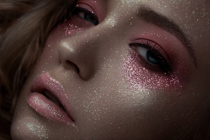 Artistic pink make-up with glitter, beauty portrait