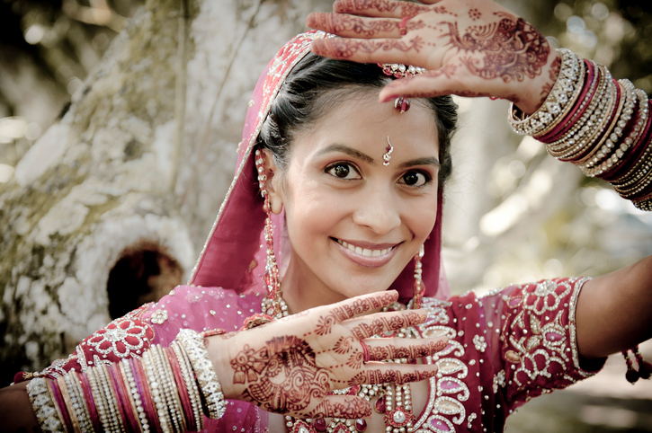Young Indian woman with henna and a traditional dress