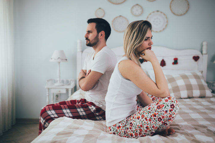 Couple having arguments and sexual problems in bed