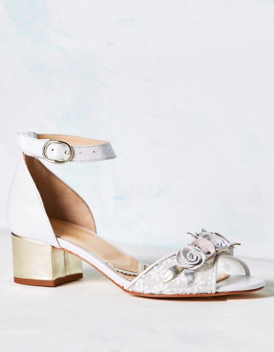 Tuscany is a beautiful satin sandal featuring a gold leather low block heel and soft...