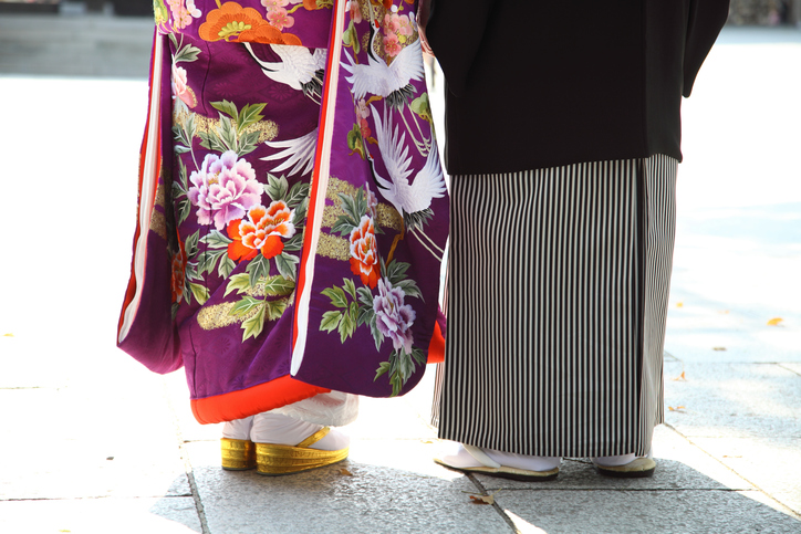 Details of a Japanese kimono and purse at a shinto wedding on