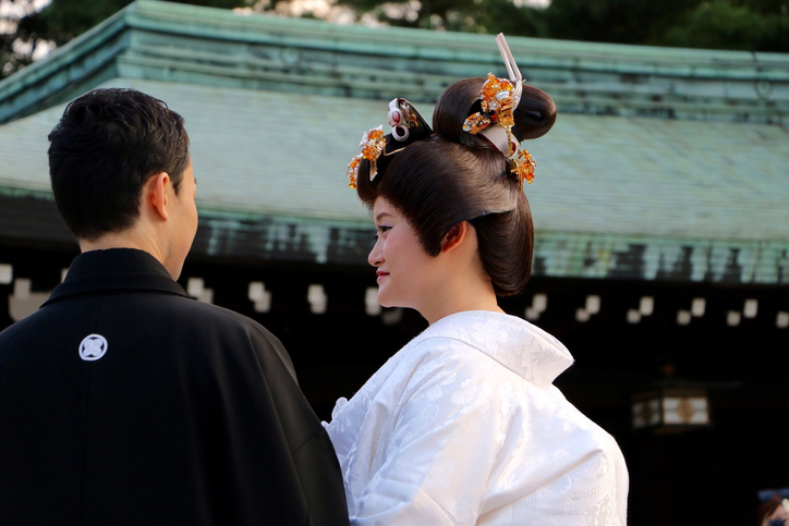 Details of a Japanese kimono and purse at a shinto wedding on