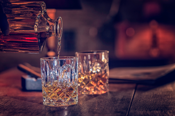 Glass of scotch whiskey served with ice