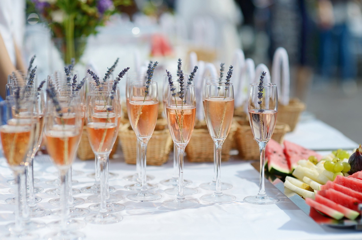 Glasses of with pink champagne decorated with lavender