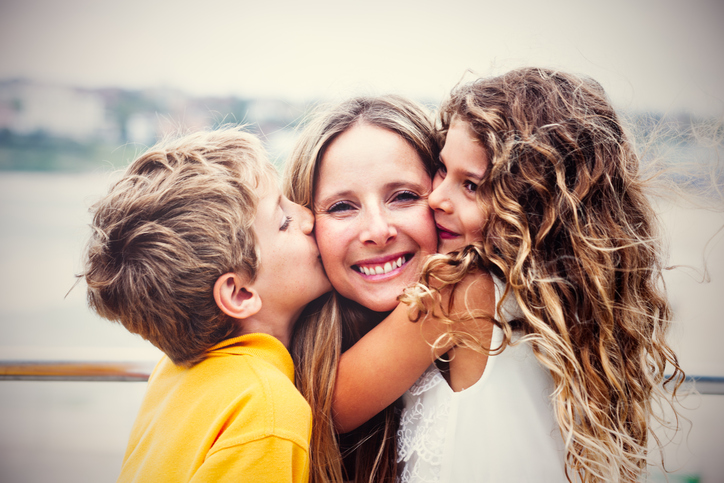 Real happy mother with her kids