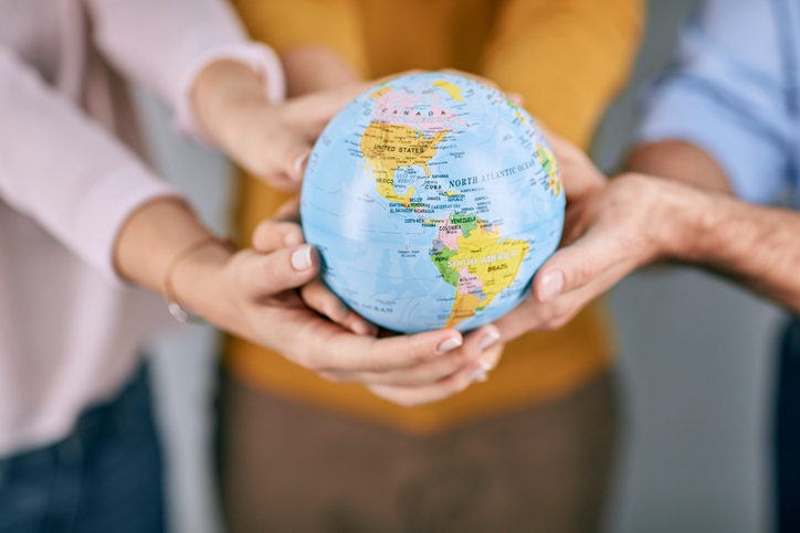 people holding earth ball.