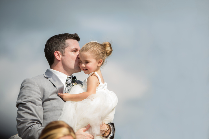 Groom Kissing Flower Girl