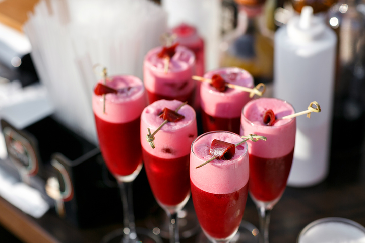 Strawberry alcoholic cocktail drinks and fruit.