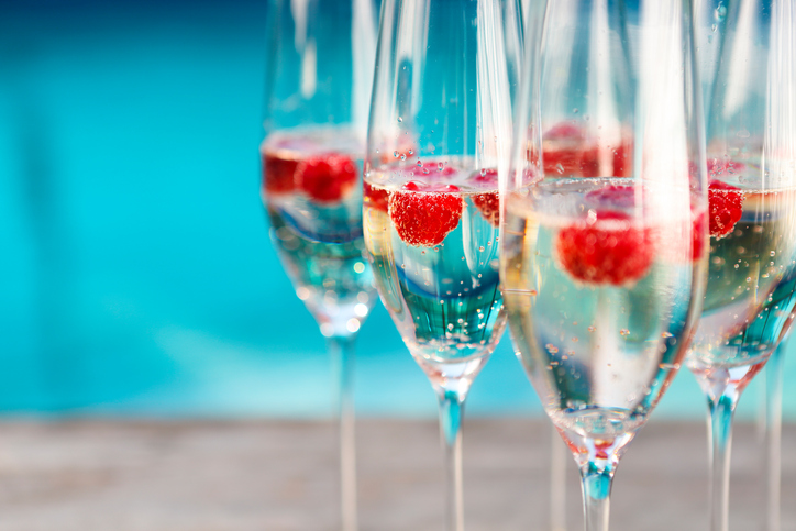 Champagne glasses with raspberry