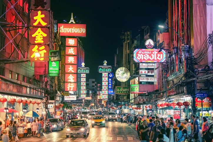 CHINATOWN, BANGKOK, THAILAND - 9 JANUARY, 2016: Cars and shops on Yaowarat road, the main street of China town.