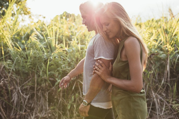 Loving young couple walking in countryside