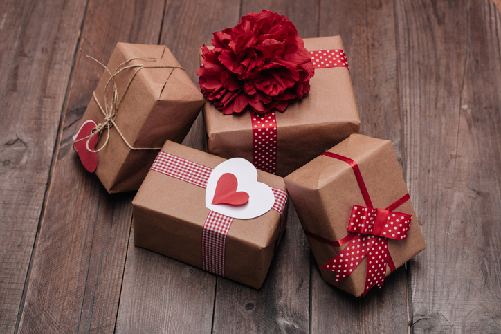 Stack of handcraft gift boxes on a wooden table