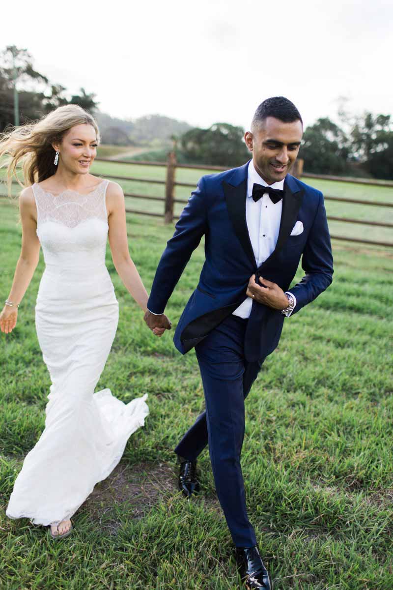 This gorgeosu bride brought a pair of thongs to change into so she could walk on muddy terrain for her wedding photos.