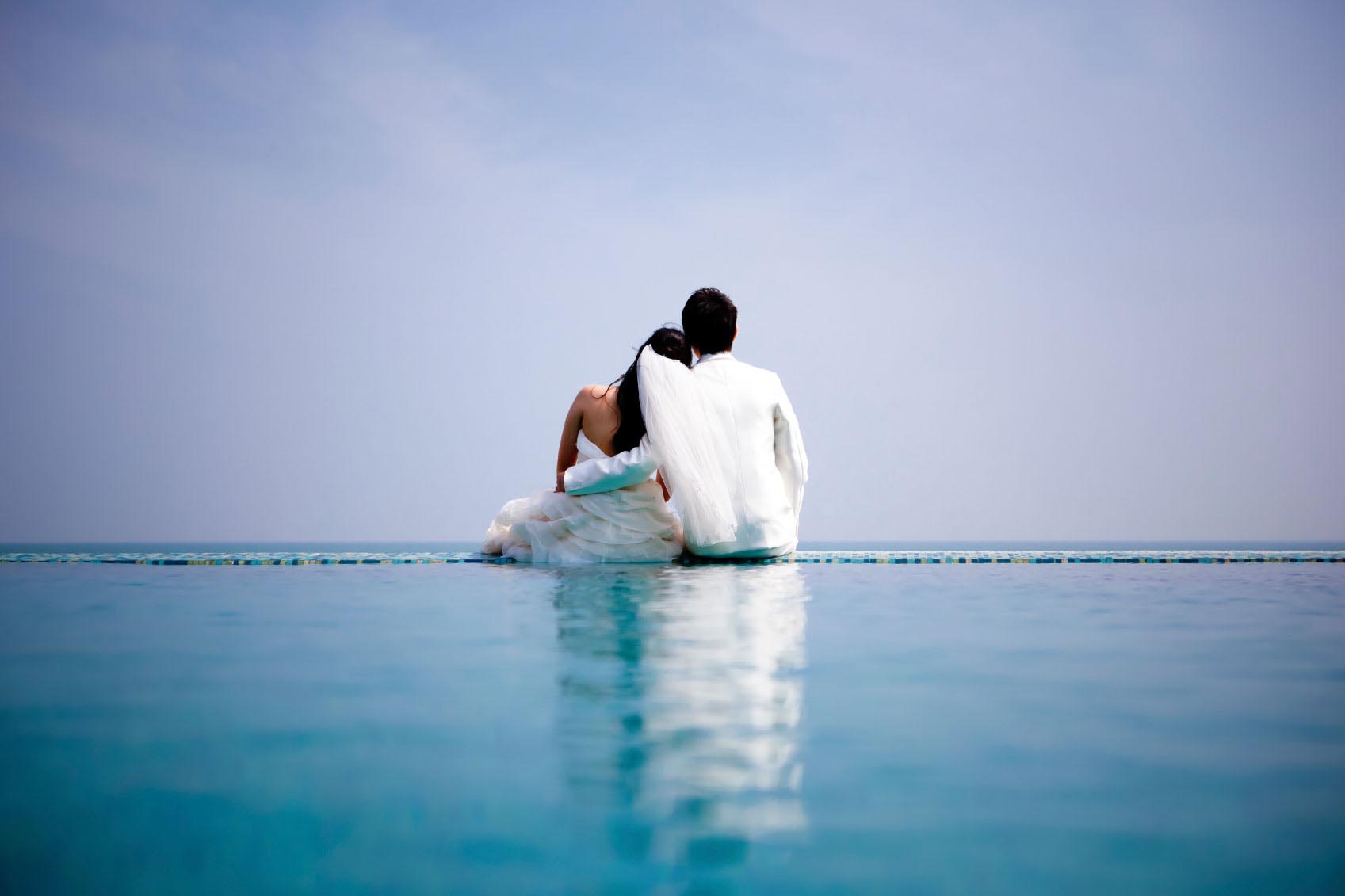 In love bride and groom are posing in romantic emotion