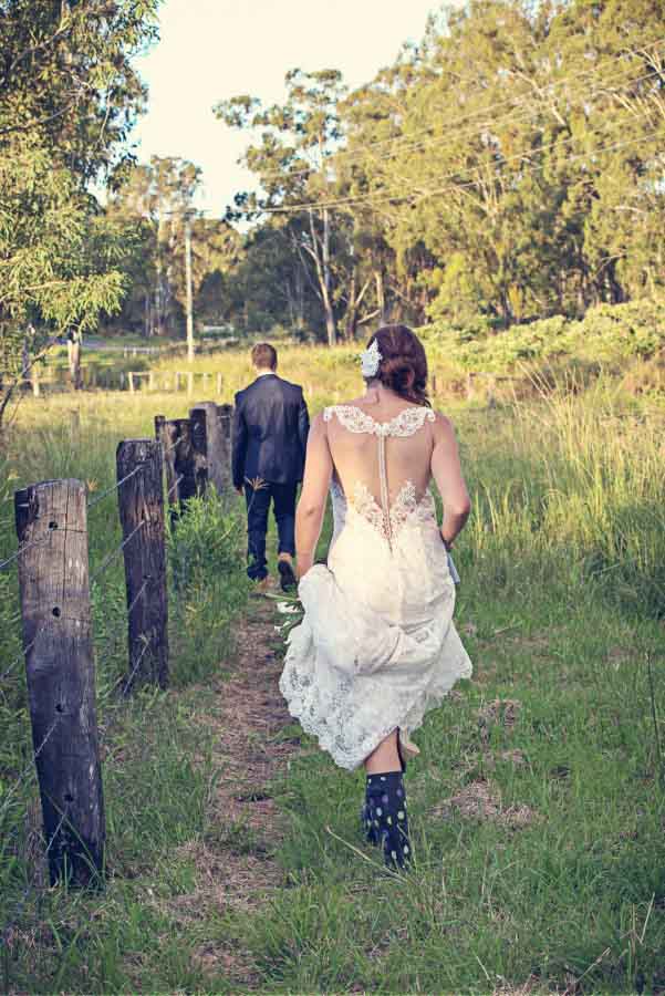 bride wearing spotty gumboots