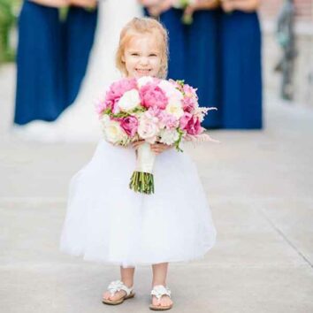 Flower girl with a bridal bouquet