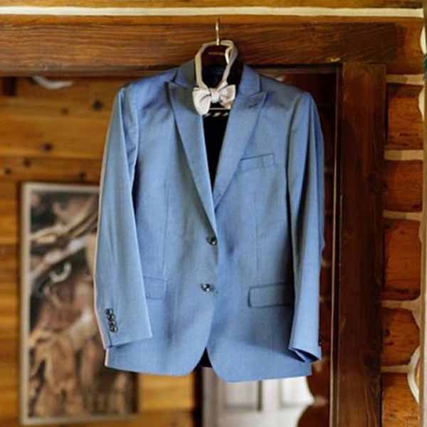 Have you seen a groom's suit hanging shots much? | Easy Weddings