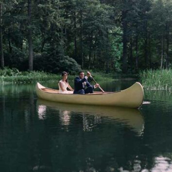 Wedding arrival in a canoe
