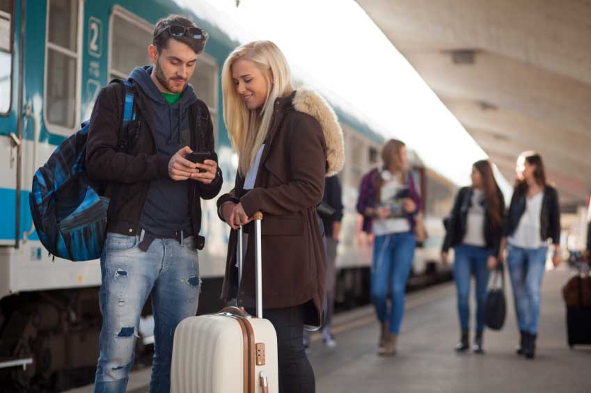 Couple travelling catching a train