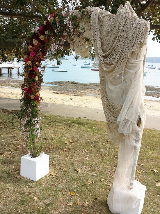 A Boho style ceremony arch. Image: Visually Creative Flowers and Event Styling