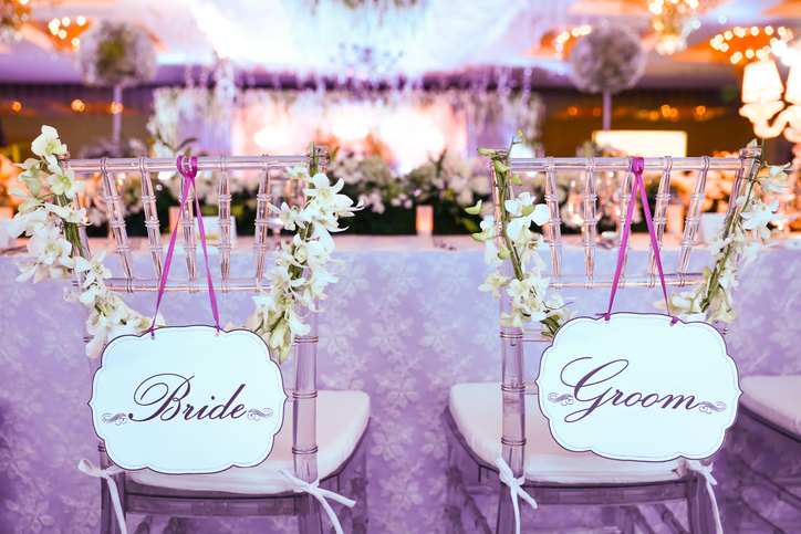Bride and groom chair at wedding reception