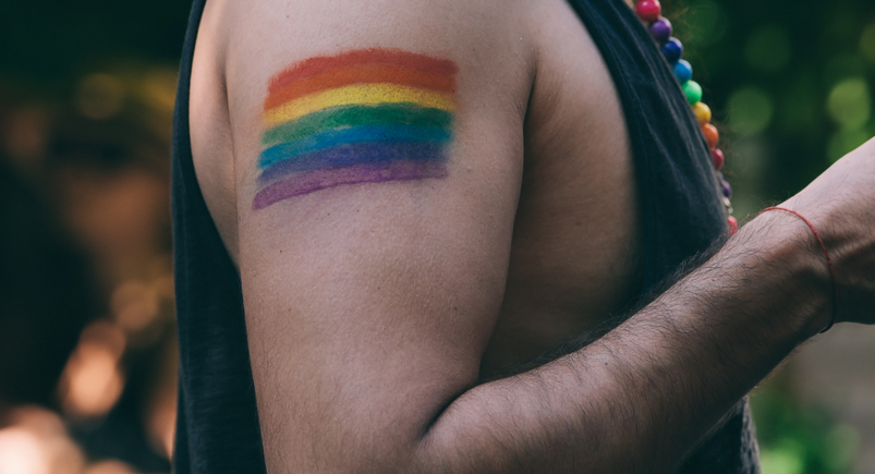 Rainbow flag sign on arm