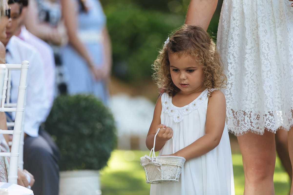 flower girl sprinkling petals down the aisle