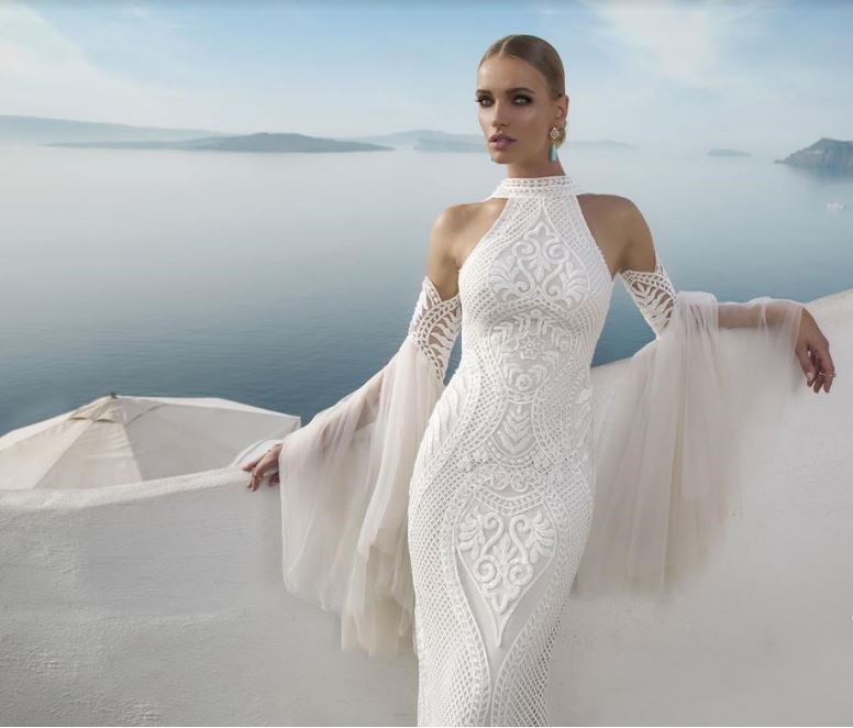 Streamer sleeves give a touch of elegance, like this Always and Forever Bridal International gown. 