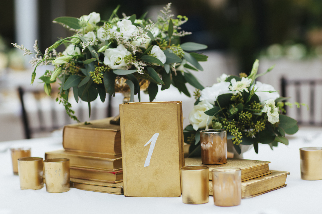 Wedding Reception Table Decor with Gold Accents and Flower Arrangements