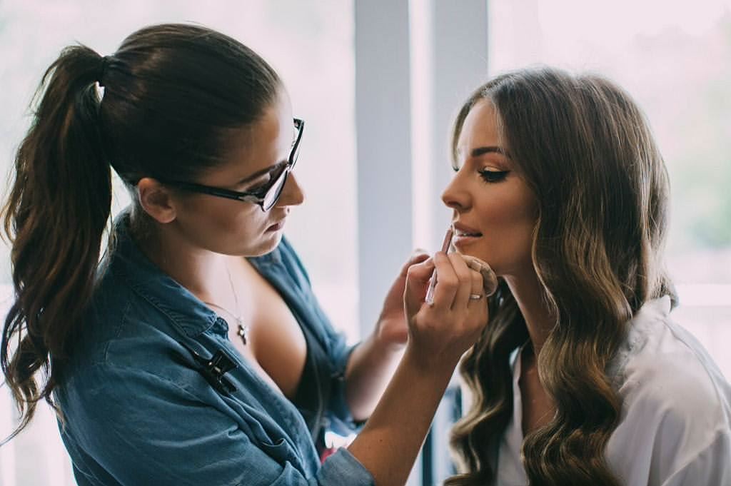 PRO-GLAM Makeup & Hair Salon MUA DOING MAKEUP ON BRIDE