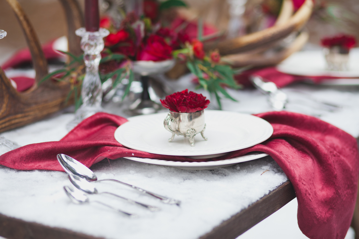 Table setting in red marsala and white colors