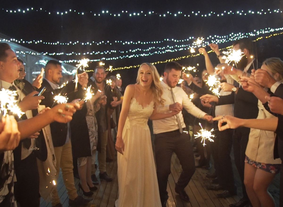 Sparklers add another dimension to night time wedding photos. Image: Gypsy Leigh Productions