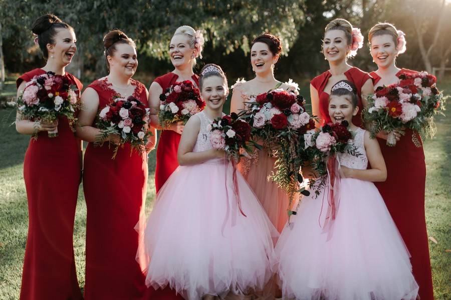 Olivia and Daniel used red to highlight their romantic wedding. Image: