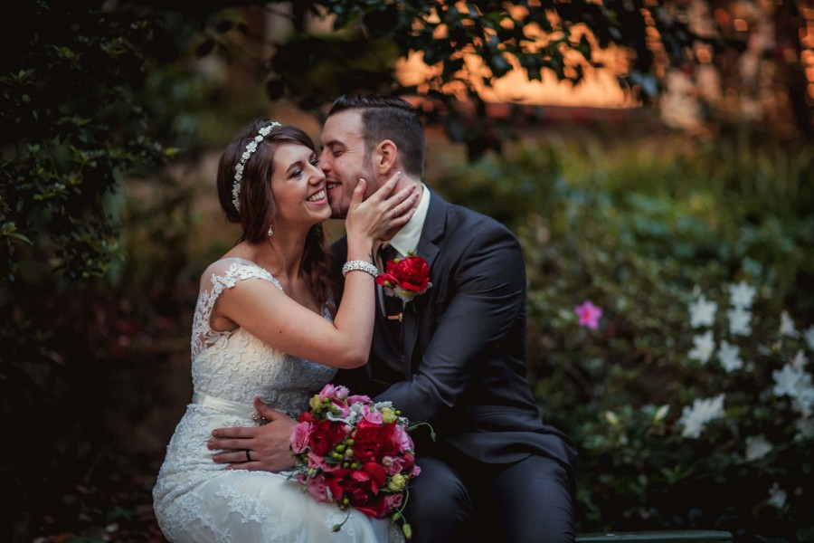 Ri and Chris's stunning chateau wedding was accented with pops of red. Image: 