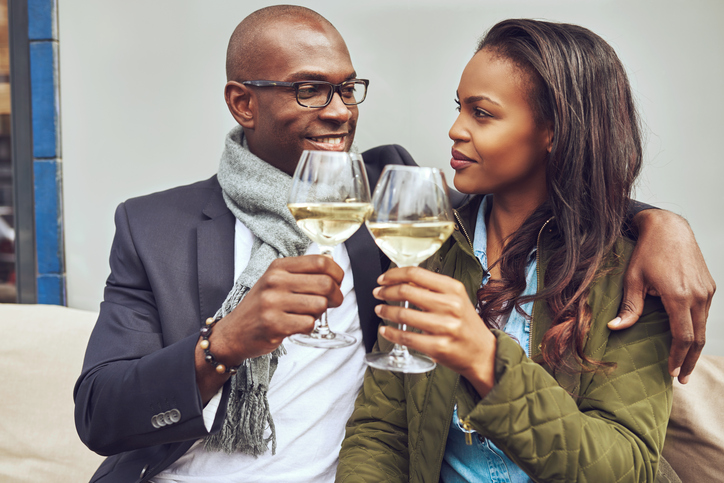 Romantic young couple share a toast