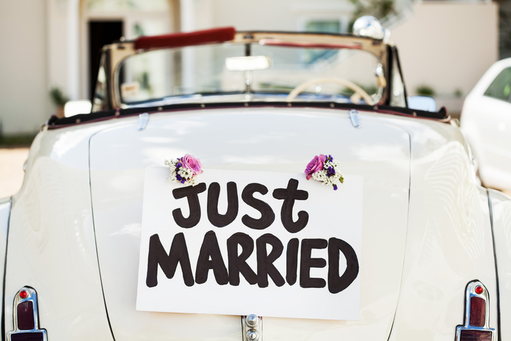 Just Married Sign Attached On Car's Trunk