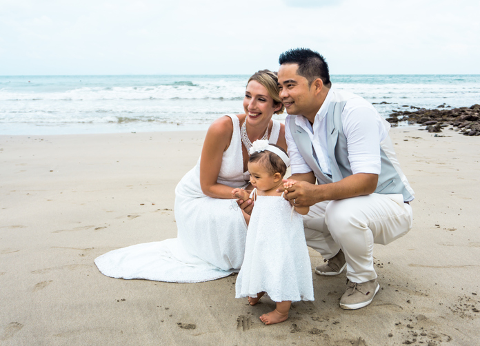 Bride and Groom on the beach with Baby Daughter