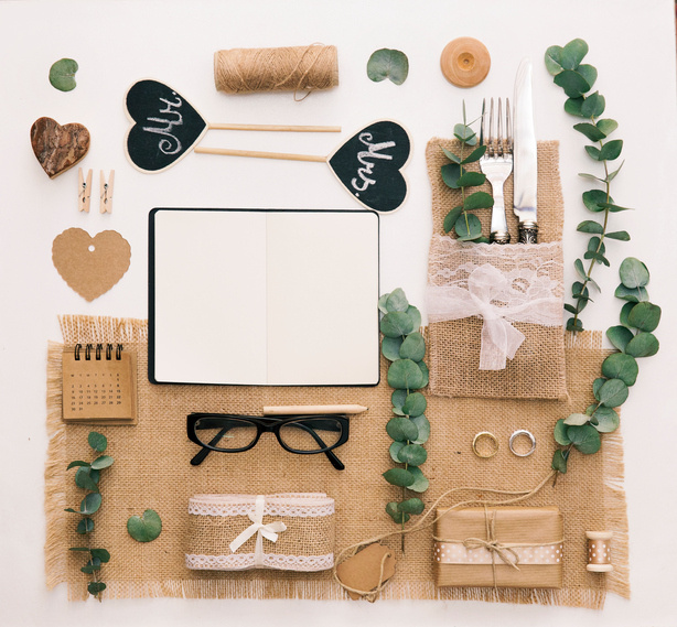 Wedding planner.  flat lay composition. Notebook with accessories and wedding decorations. Workspace, top view.