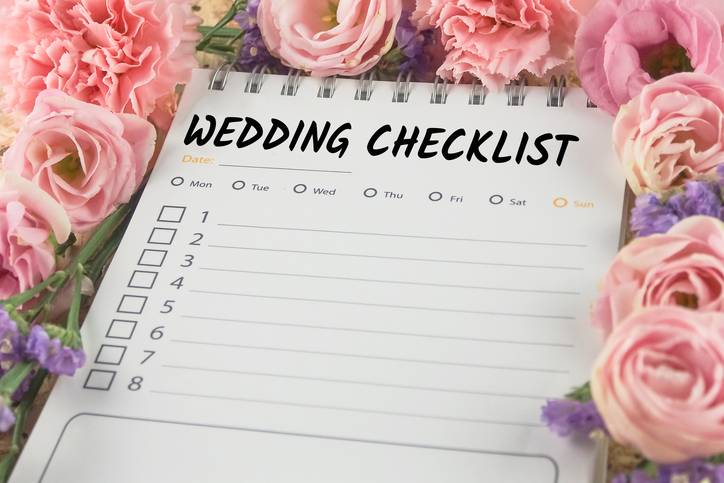 word wedding checklist note paper on pink flower background