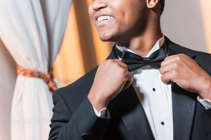 Young black Hispanic man wearing tuxedo